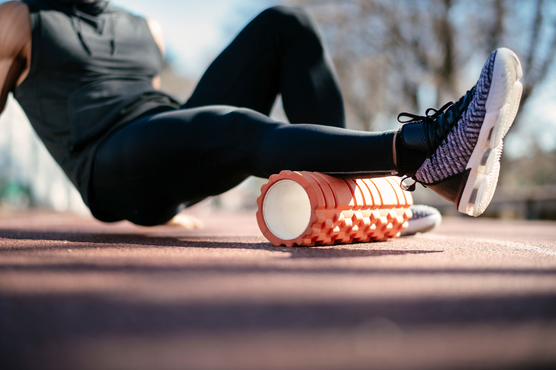 a man is using a foam roller